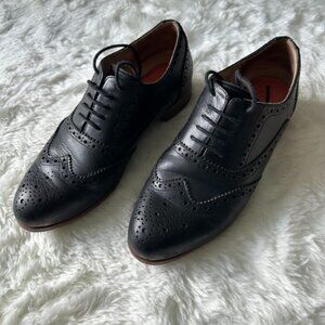 Women's black leather brogues